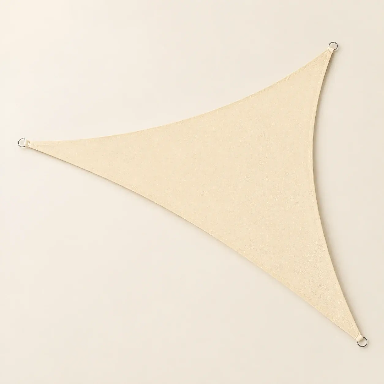 Cream Triangle Shade Sail, selected product photographed on warm ivory
