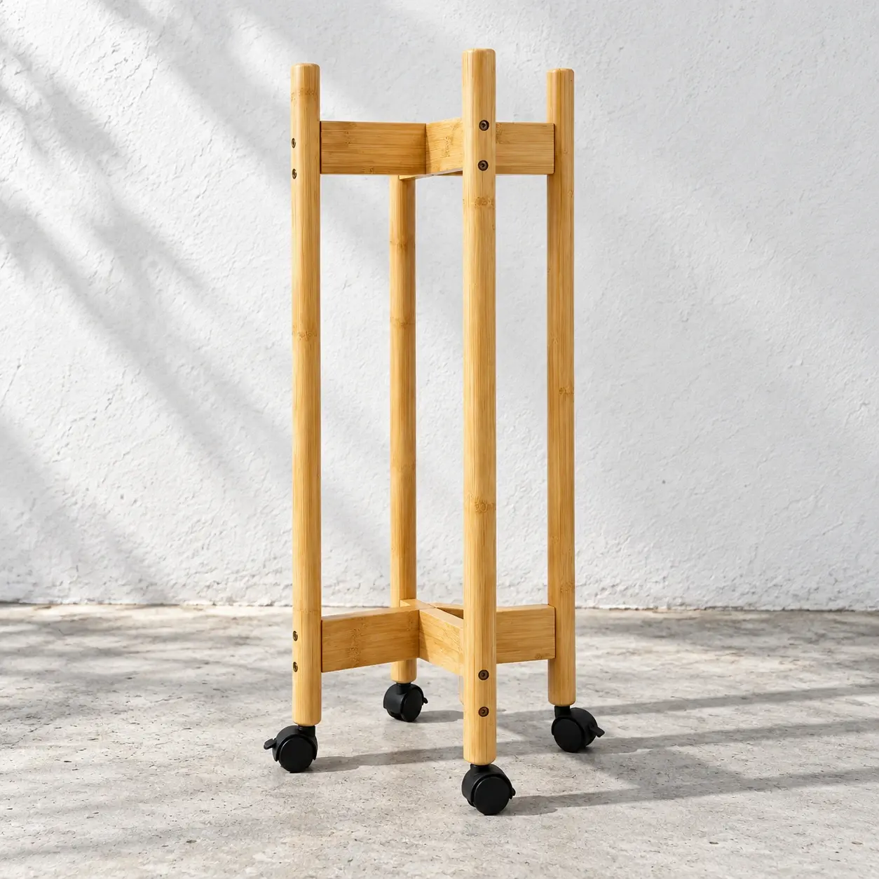 Empty bamboo plant caddy with two levels and four casters