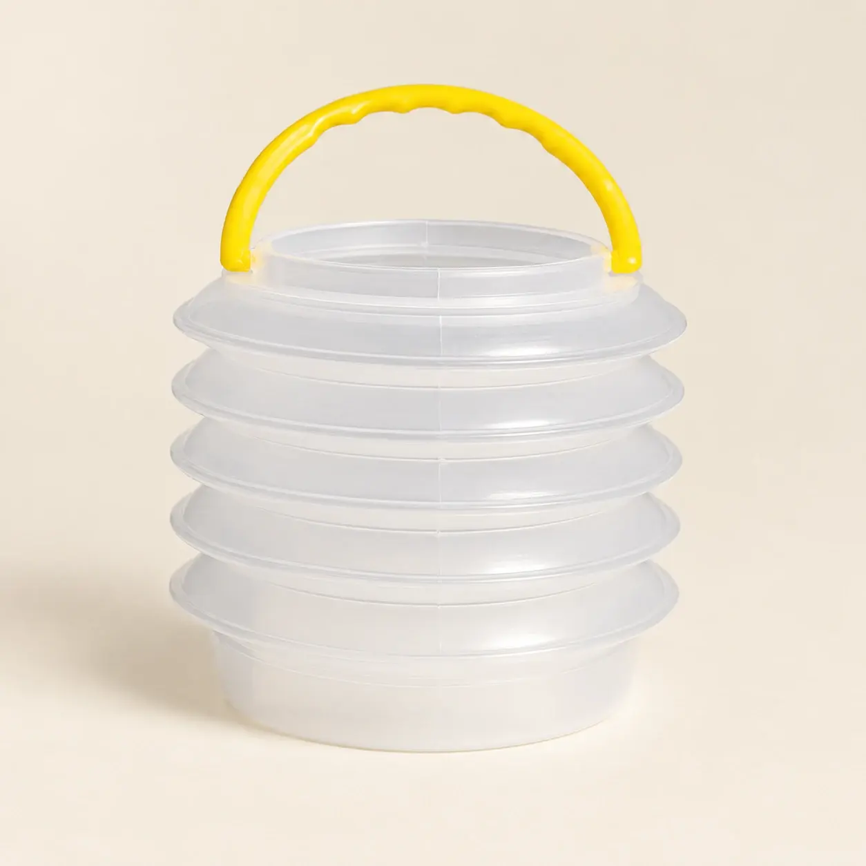 Collapsible Brush Water Pot, selected product photographed on warm ivory