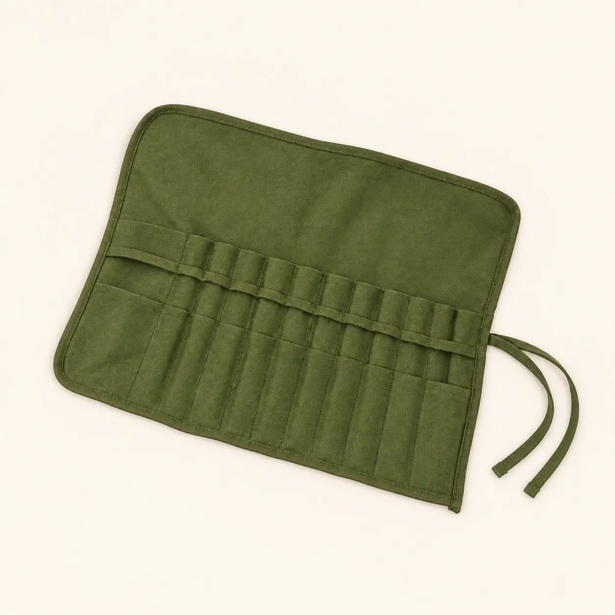 Olive Brush Roll, selected product photographed on warm ivory