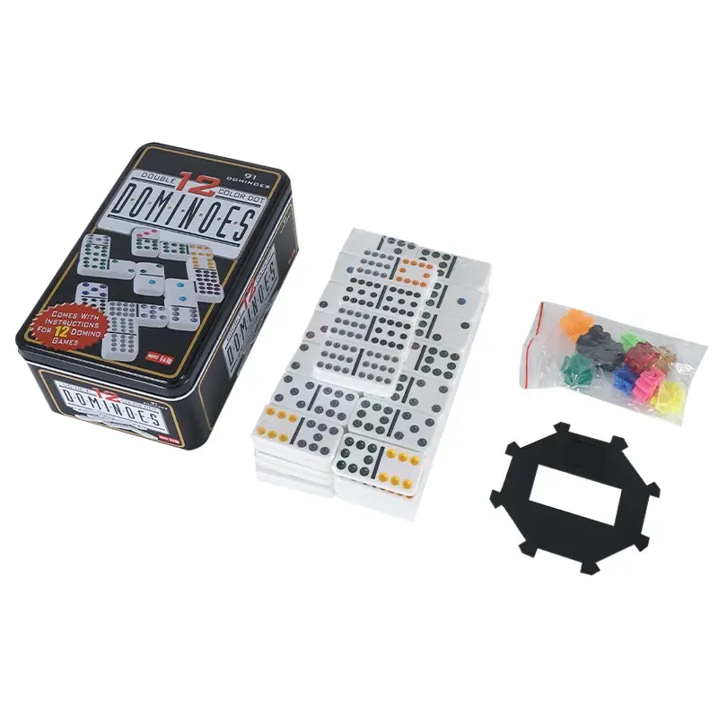 Double twelve domino tiles with their tin and selected accessories